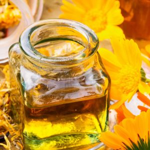 Healing calendula flowers and herbal tincture.Aromatherapy essential oil