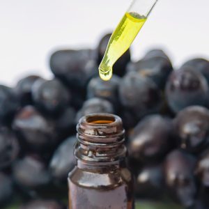 Grape seed oil in a small bottle. Selective focus. nature.